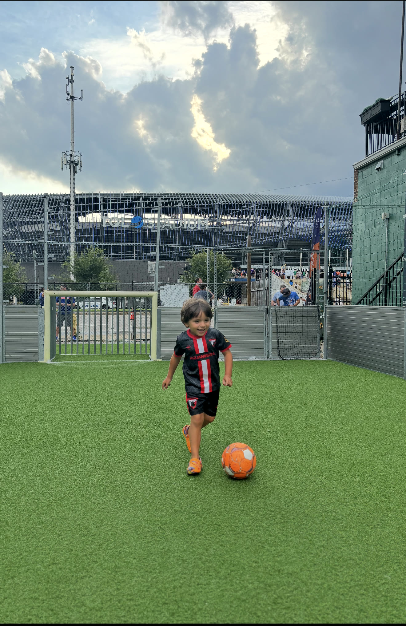 A young Valhalla in the black and red kit chasing the ball in Cincinnati